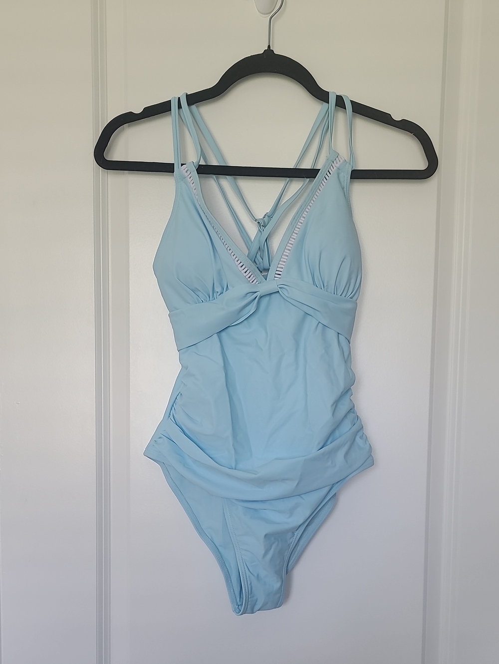 Light Blue One-Piece Swimsuit with Crisscross Straps. BB 49